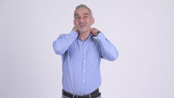 Stressed Persian Businessman Having Neck Pain Against White Background