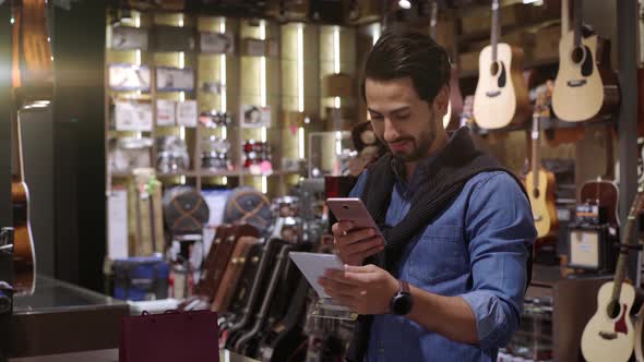 A Middle Eastern Man Using Mobile Phone To Scan QR Code 