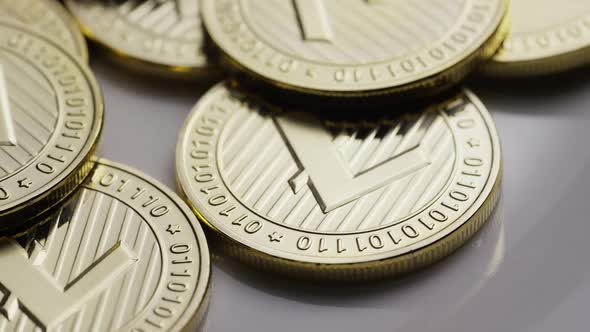 Rotating shot of Litecoin Bitcoins (digital cryptocurrency) - BITCOIN LITECOIN