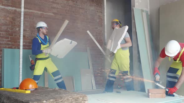 Builder Fighting with Construction Tools and Materials on Work Site
