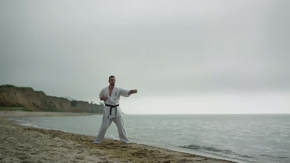 Judo Fighter Doing Workout on Sandy Beach