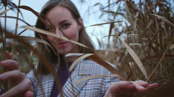 Beautiful Woman In Plants In Countryside