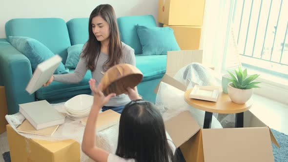Happiness active asian family playing on moving day