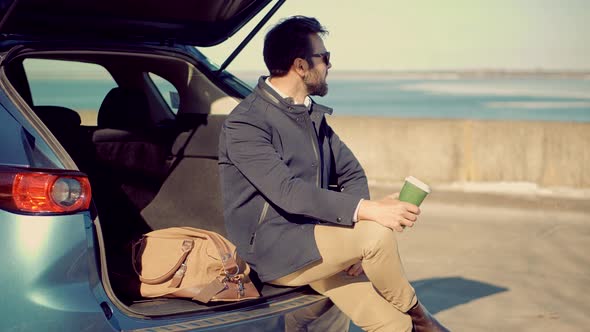 Man Enjoying Holiday And Drinking Coffee. Businessman Drinking Tea On Vacation.