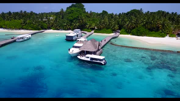 Aerial top view travel of paradise island beach adventure by clear lagoon with white sand background