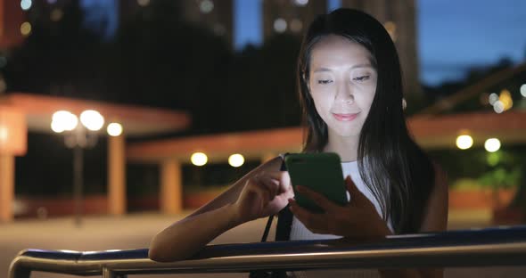 Woman use of cellphone at night 