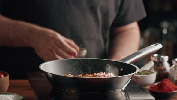 Chef Frying Ribs with Flambe Technique
