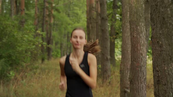 Beautiful Woman Runs Around the Park