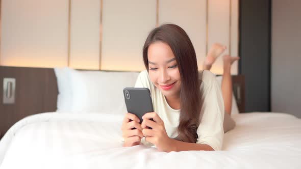 Young asian woman use smart phone