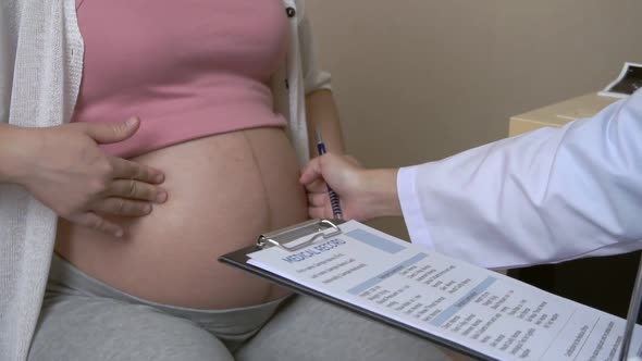 Pregnant Woman and Gynecologist Doctor at Hospital