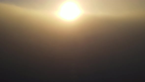 Aerial of the sunrise above the clouds