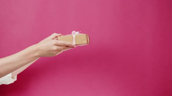 Square Cardboard Box on Pink Background