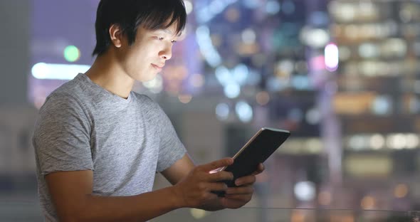 Asian Man Look at Tablet Computer