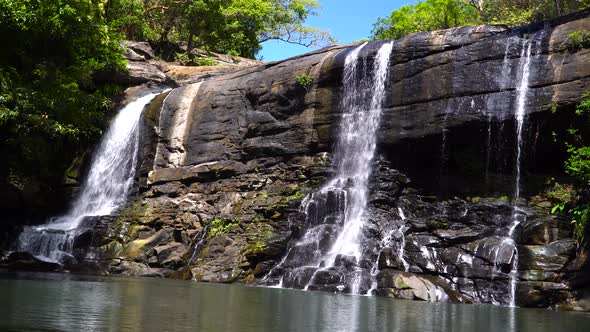 A Tropical Waterfall in a Mountain Canyon Surrounded By Jungle