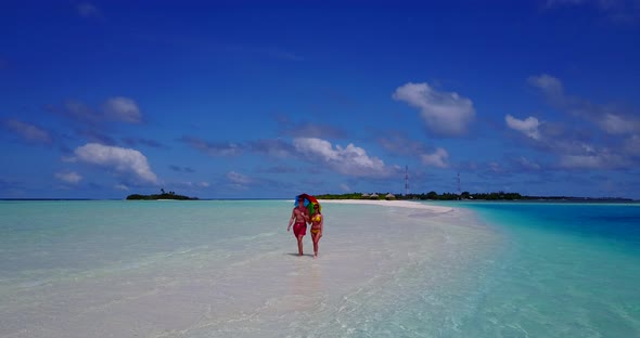 Romantic lady and man on romantic honeymoon enjoy life on beach on summer white sandy 4K background