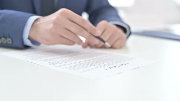 Businessman Reading Contract