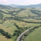 Drone filming of the Carpathian mountains in Ukraine. Cars are driving along the winding road - VideoHive Item for Sale