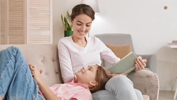 Woman Reading to Her Daughter
