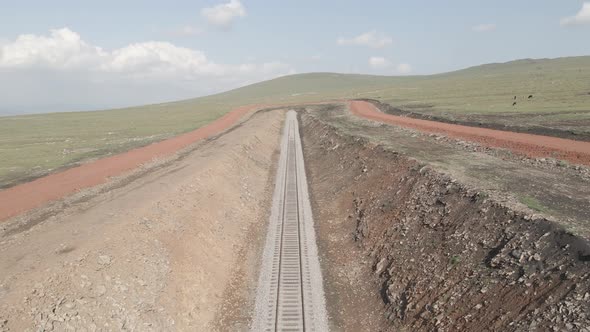 Moving along railroad tracks. Aerial view of Railroad emergency stop track in Trialeti, Georgia