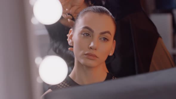 Model gets Hair Styling and Make Up