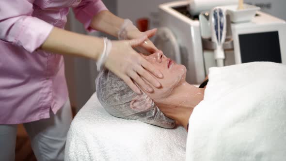 Beautician Prepares Laser Rejuvenation Facial Hair Removal Woman in Beauty Salon