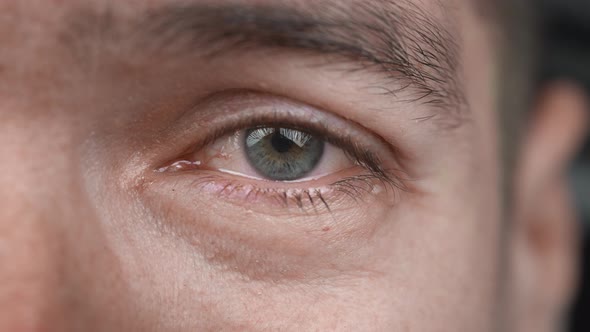 Closeup Shot of Crying Man with Tears in Eye