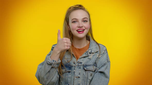 Teenager Girl Raises Thumbs Up Agrees or Gives Positive Reply Recommends Advertisement Likes Good