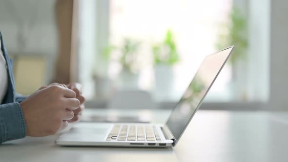 Hands of Man Typing on Laptop