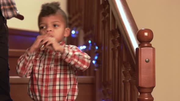 Standing Black Kid Plays Flute.