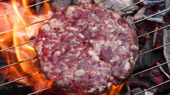 Searing beef burger for hamburger on BBQ grill
