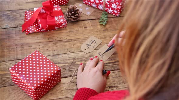 Writing name on gift tag for Christmas present