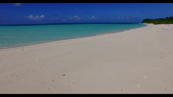 Aerial top down panorama of tropical tourist beach break by blue sea and white sandy background of a