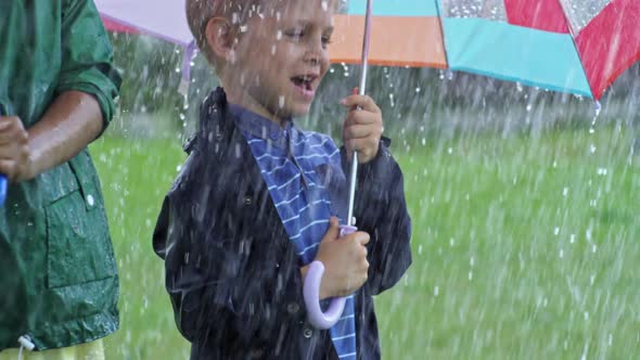 Ecstatic Children Enjoying Rainy Day