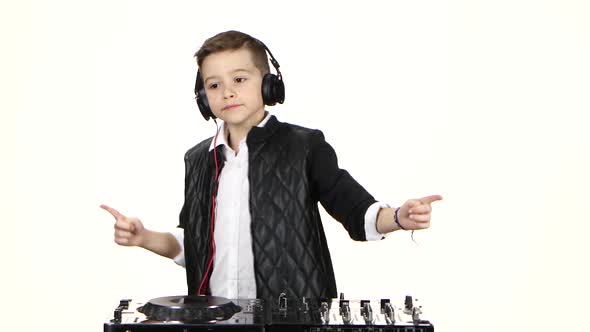 Stylish Boy Dj in Headphones Playing on Vinyl. White Background