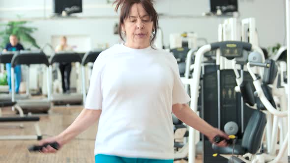 Elderly Woman Jumping with Skipping Rope.