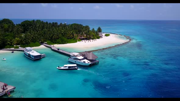 Aerial view scenery of marine sea view beach adventure by transparent lagoon with clean sandy backgr
