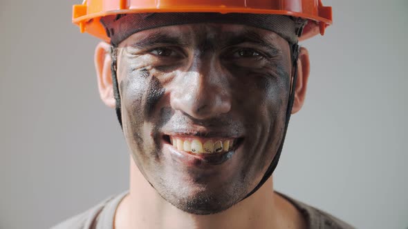 Dirty Mine Worker. Beautiful Caucasian Man Hard Hat Smiles. Filthy Job