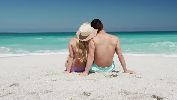 Couple in love enjoying free time on the beach together