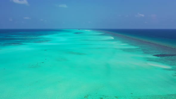 Wide angle aerial abstract view of a white sand paradise beach and aqua blue ocean background in bes