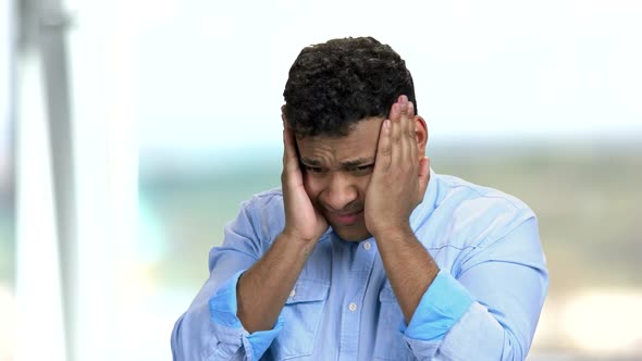 Young Dark-skinned Man Suffering From Headache