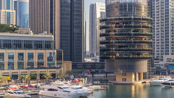 Aerial Vew of Dubai Marina with Shoping Mall Restaurants Towers and Yachts Timelapse United Arab