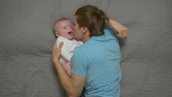 Father Cheers Baby Boy