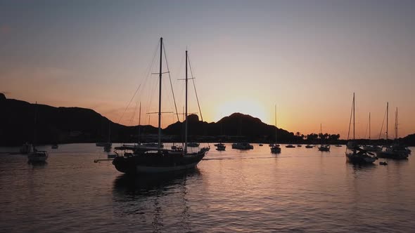 Aerial View on Seashore of Lipari Island. Mountains and Colorful Sky. Moored Vessels. Mediterranean