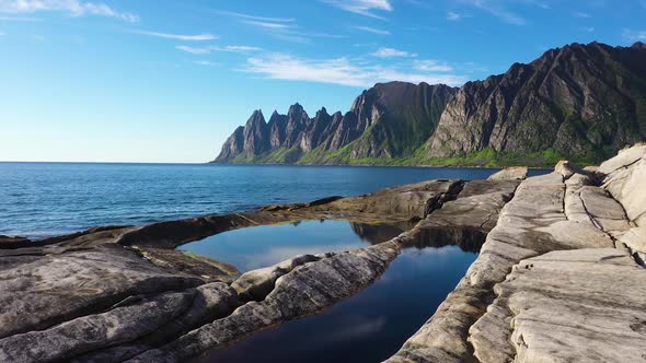 Popular travel destination and Rock Davil’s Jaw in the sunny summer day, Norway,island Senja