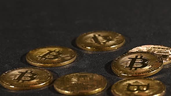 Golden bitcoin physical coins fall and bounce