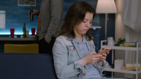 Cheerful Woman Browsing on Social Media Using Smartphone