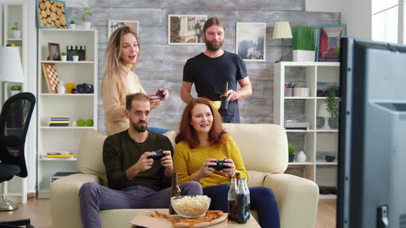 Two Girl Laughing While Playing Video Games