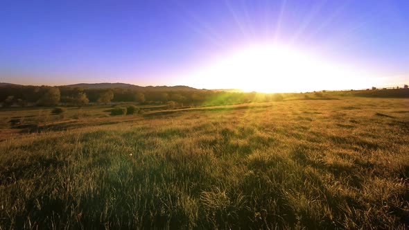  UHD Mountain Meadow Timelapse at the Summer. Clouds, Trees, Green Grass and Sun Rays Movement.