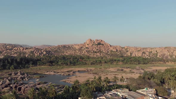 Rocky landscape and barren Tungabhadra Riverbank at Hampi town's edge, Karnataka, India