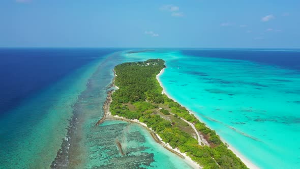 Aerial panorama of beautiful seashore beach voyage by blue ocean and white sand background of journe